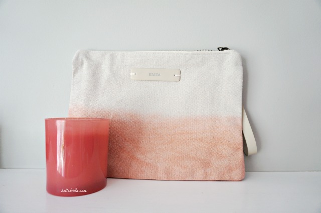 Minted sells a variety of colorful gifts at different price points, like this canvas clutch and glass candle. | Belle Brita