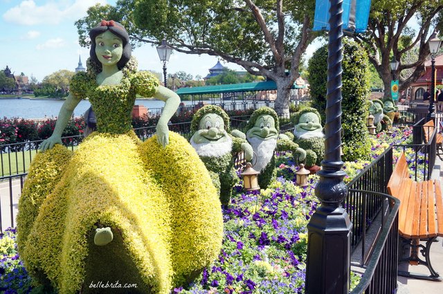 Snow White and the Seven Dwarfs are just the most delightful of topiaries in EPCOT's Germany. | Belle Brita