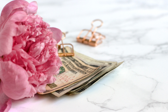 Pink peony, money, marble background