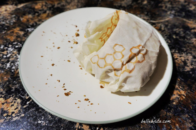 Bread wrapped in beeswax wrap on a plate