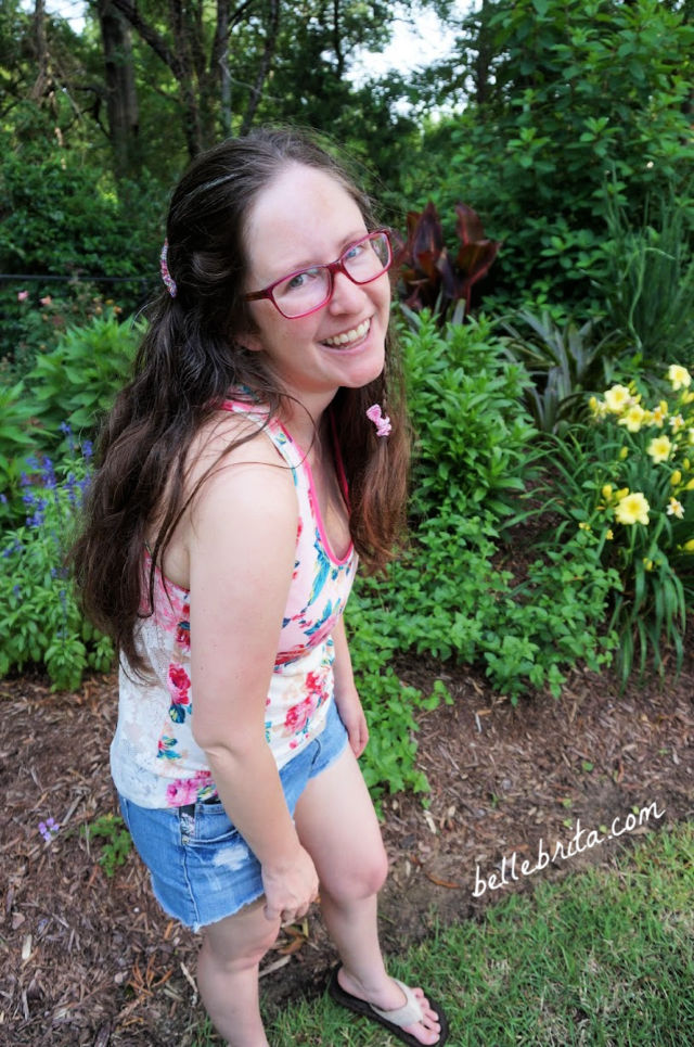 White woman standing in a garden