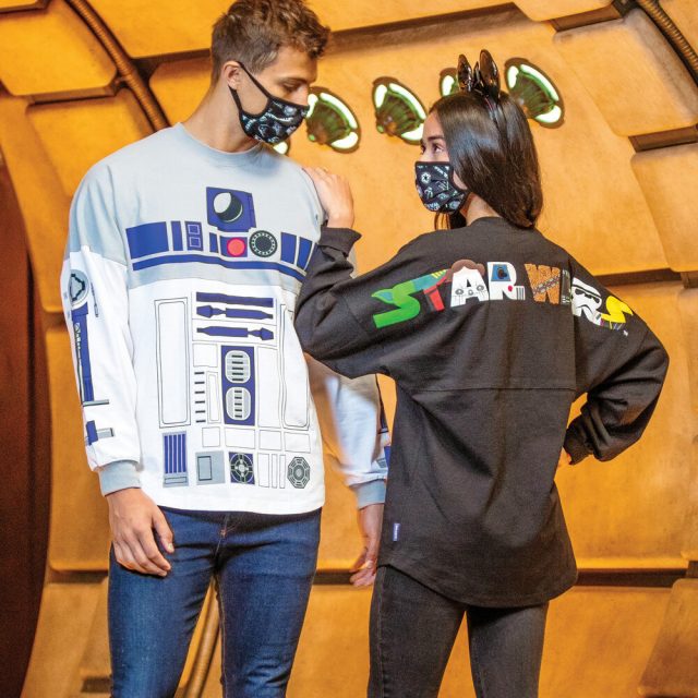 Man and woman wearing Star Wars face masks and Star Wars spirit jerseys