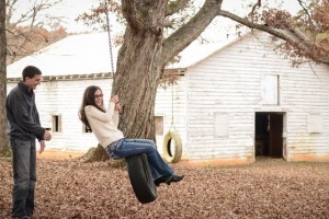 A tire swing makes for a great prop during an engagement shoot.